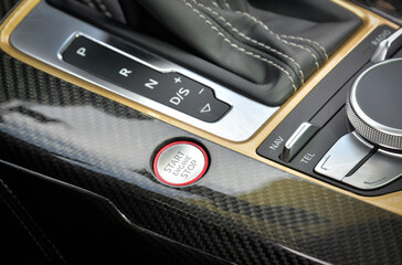 Engine start and stop button on a car at a car show