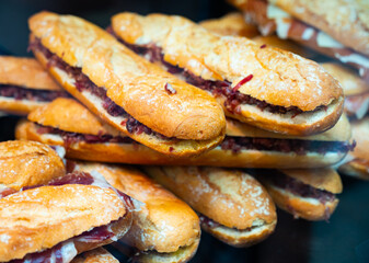 Bocadillos with ham on showcase of Spanish fast food cafe