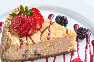 Slice of cake or cheesecake with strawberry jam decorated with red berries, dessert, food