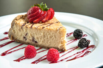 Slice of cake or cheesecake with strawberry jam decorated with red berries, dessert, food