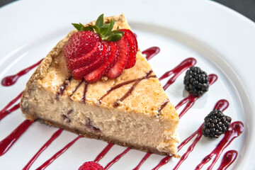 Slice of cake or cheesecake with strawberry jam decorated with red berries, dessert, food