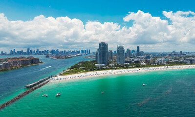 Aerial view of Miami Beach with turquoise waters. Drone shot of Miami skyline. Top view of South Beach. Miami cityscape with luxury skyscrapers and ocean. View of Miami famous coastline.