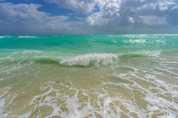 Sea waves background. Summer holiday. Ocean water motion. Ocean splash wave background. Deep blue sea beach. Turquoise wave. Dreamy exotic sea beach. Beautiful sea beach waves.