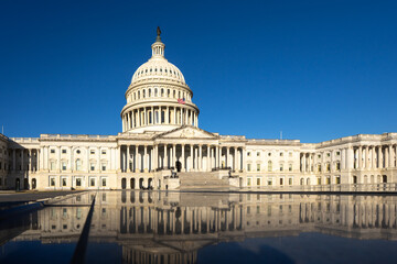 Capitol in Washington, DC. The state capitol buildings in Washington, DC. The Congress in Washington, DC. American flag waving. The Capitol Hill in Washington, DC.