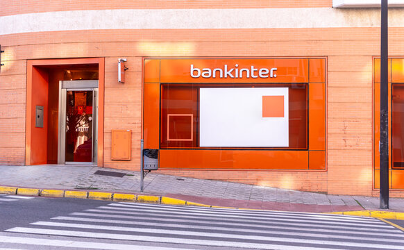 Dos Hermanas, Seville - Spain; 02-06-2025. Exterior view of a Bankinter bank branch with logo sign on facade.
