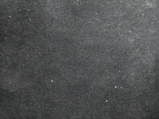 Fototapeta premium A grainy and textured image presents a seemingly endless expanse, punctuated by scattered small, white dots resembling distant stars.