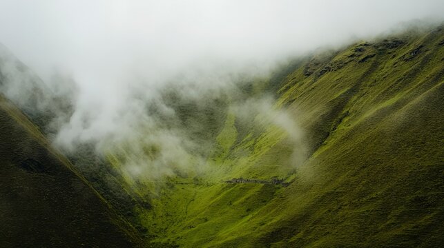 Aerial View of Misty Green Mountains Surrounding Machu Picchu