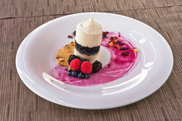 Coconut ice cream dessert with red berries, dried fruit, frozen dessert with fresh fruit, tiramisu