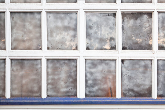 old grunge multi panel window with street reflection