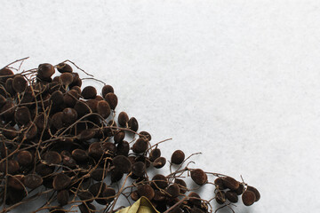 Overhead view of green vintage necklace on marble jewelry holder, top view of vintage green beaded necklace on a white background