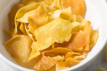 Overhead view of golden sweet potato chips, top view of crispy fried sweet potato chips