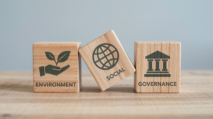 Elegant macro of three wooden ESG blocks on beige surface, soft blue-gray blur background, minimalist green icons and text, natural wood texture, soft lighting