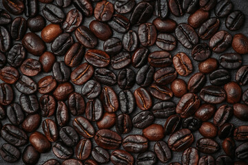 Coffee beans on the rustic background. Shot from above. Background and textures.