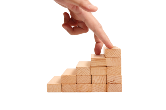 Building success progression of wooden blocks office desk setting abstract concept inspirational mood close-up view