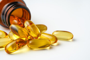Vitamin capsules in a bottle, soft gels, Fish oil capsules, omega 3, omega 9, vitamin D, vitamin E