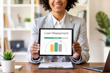 Businesswoman holding tablet showing loan repayment progress, representing finance and credit management