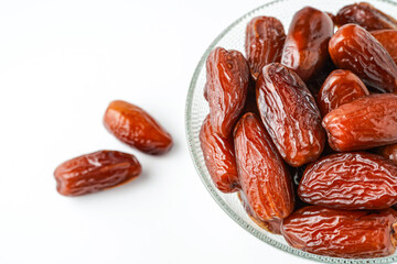 Dates fruit tunisia, Tunisian honey dates, in bowl isolated on white background