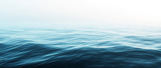 Fototapeta premium serene view of calm ocean with gentle ripples under clear sky, creating peaceful and tranquil atmosphere. water surface reflects soft gradient of blue hues