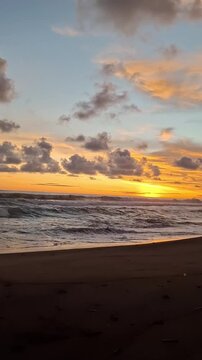 the beauty of the sky at sunset on the edge of the black sand beach