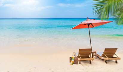 Tropical summer beach background, relaxing by the sea, beach chair and umbrella on sandy beach, outdoor day light