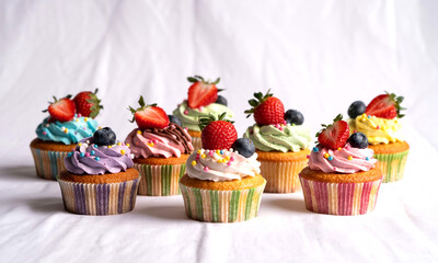 Delicious colorful cupcakes with frosting and fresh berries perfect for dessert or party treats delight