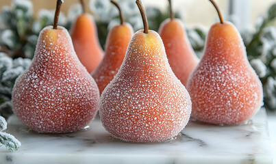 Frosted pears arranged on a marble surface, with a snowy background creating a winter ambiance