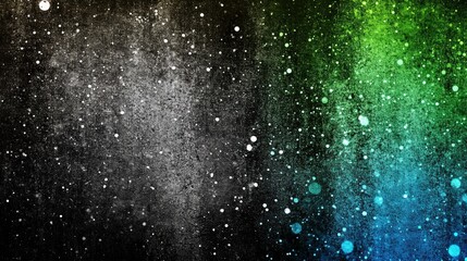 Obraz premium A vibrant, speckled cosmic nebula in shades of green, blue, and gray.