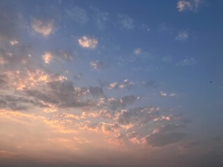 Whispered Skies: Delicate Cloud Patterns at Twilight on West Lake in Hanoi, Vietnam