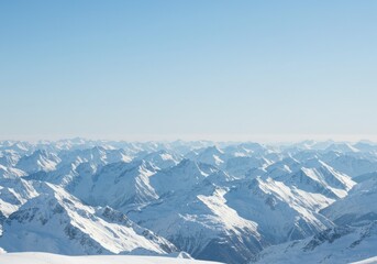 Obraz premium Snowy Mountain Range Under Clear Blue Sky on Sunny Day