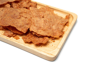Sweet crispy pork slices, dried on a wooden tray