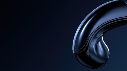 Sleek, dark object, curved design, futuristic shape