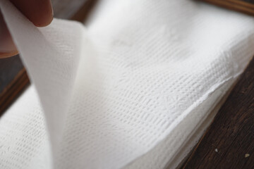 pick a tissue paper from a box 