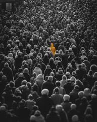 Obraz premium Massive black and white crowd with single colored person, striking contrast concept, monochrome group portrait with one highlighted individual. 