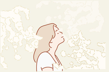 woman inhales the fragrance of spring flowers of blooming jasmine or cherry tree. Spring time concept. Hand drawn style vector design illustrations.