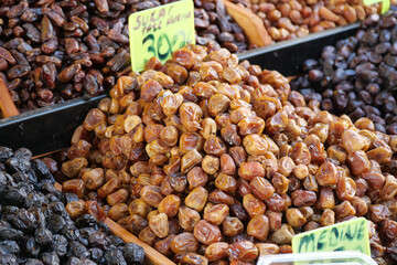 Fresh dates displayed at a local market in the afternoon sun