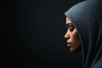 A person experiencing the disgust of being treated unfairly, A serene profile of a woman wearing a hood, showcasing elegance and introspection against a dark backdrop.