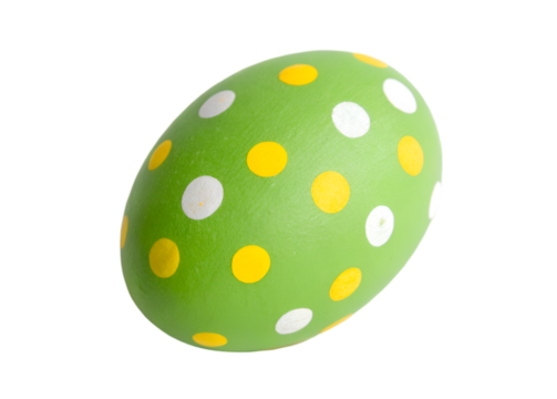 Green Easter egg with yellow and white polka dots, playful and festive decoration isolated on transparent background.
