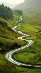 Winding mountain road in lush green valley, scenic landscape, possible use for travel, tourism, or nature