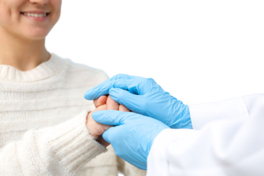 A nurse gently holds a patient's hand, showcasing care and dedication, isolated on white, PNG