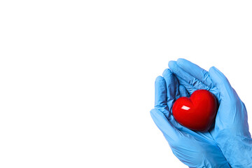 Hands in blue gloves hold a red heart symbolizing nursing care, isolated on white, PNG