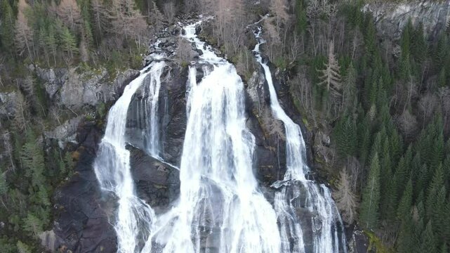 Ascending aerial footage of the Furebergfossen waterfall in Mauranger district in Vestland, Norway