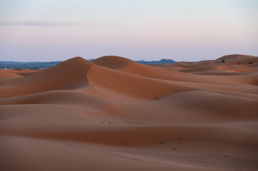 Sunset over the Sahara Desert dunes in Merzouga, Morocco