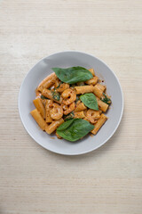 A plate of creamy prawn rigatoni pasta.