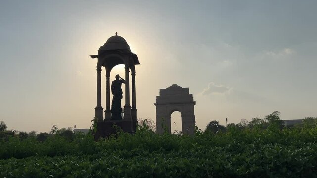 Statue of Subhas Chandra Bose and India Gate at sunset in New Delhi, Delhi, India