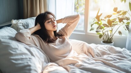 Serene morning, Young woman stretches in bed with gentle sunlight