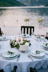 Wedding cake stands on a stand on a festive table set