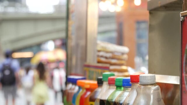 New York City life, Manhattan Midtown 42 street. Fast food hot dog, street food kiosk. Defocused people pedestrian near Grand Central Terminal Station, Pershing Square Bridge USA. Precel, hotdog to go