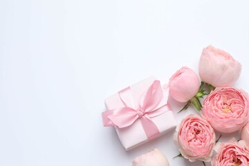 Beautiful pink peony roses with gift box on white background, space for text