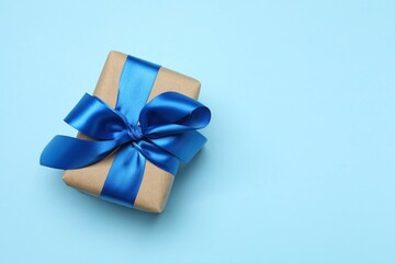 Beautiful gift box on color background, top view