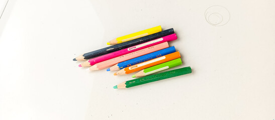 colored pencils on white background